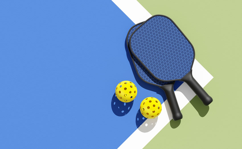 Pickleball rackets and balls in the game